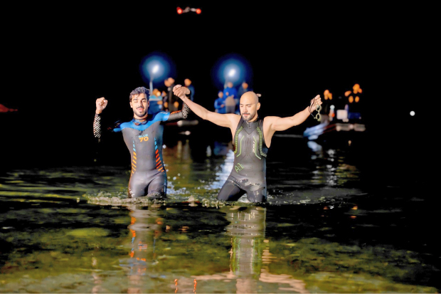 Duo conquer swim challenge
